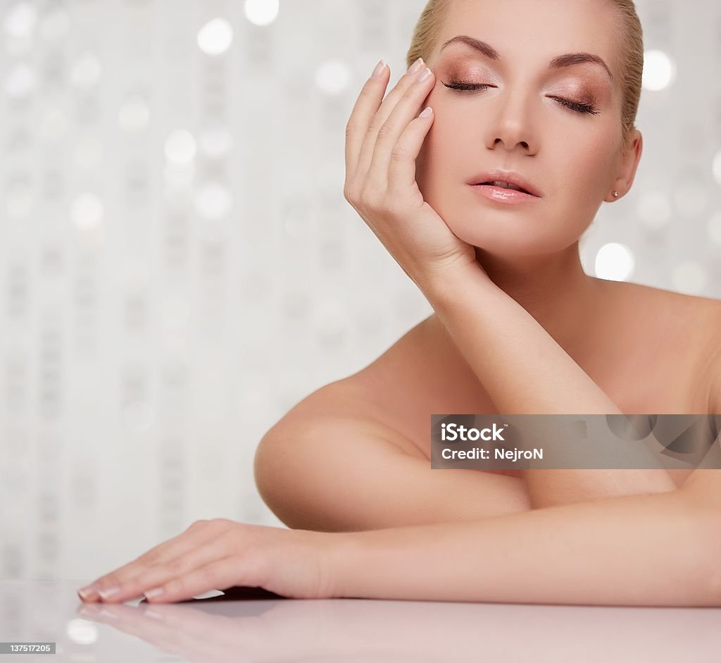 Beautiful woman touching her face. Adult Stock Photo