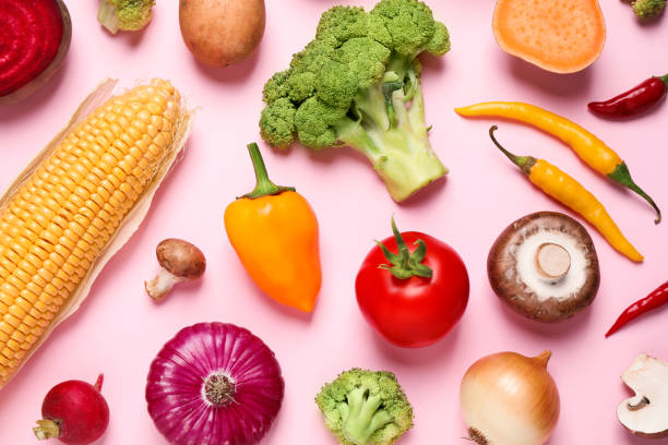 istock Flat lay composition with fresh vegetables on pink background 1375177894