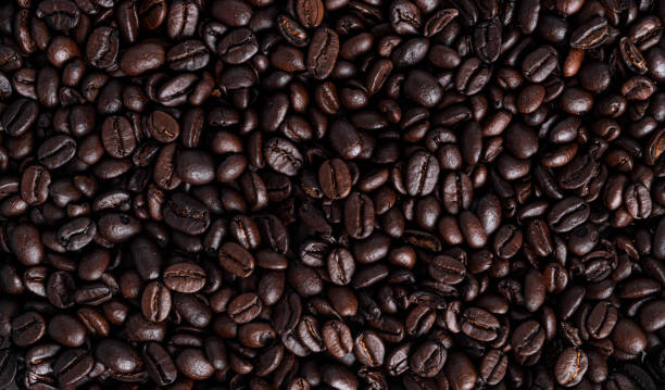 istock Coffee beans background. Coffee beans heap. Coffee 1375183094