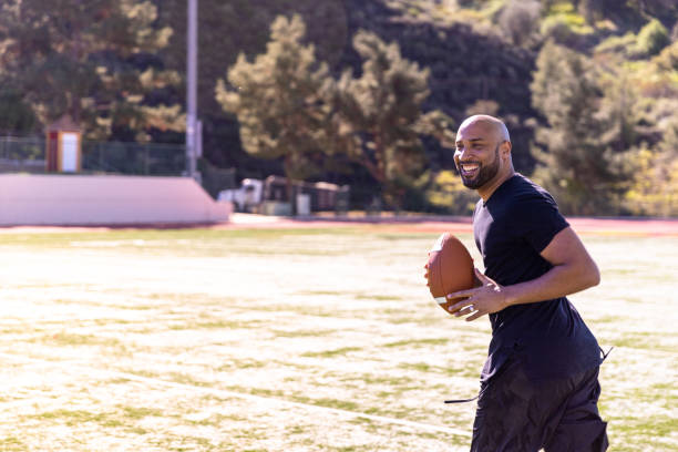 Fit black man throwing the football