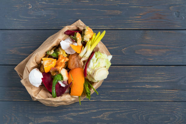 istock Vegetable and fruit waste from cooking, collected in a garbage bag for recycling. Compost. The concept of zero waste. 1375203117