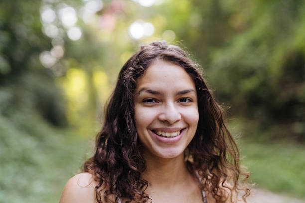 istock Woman smiling in the natural park 1375207572