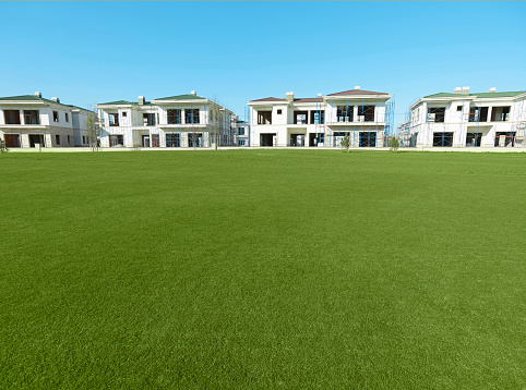 Beautiful modern construction by a grass field