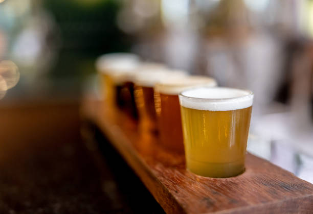 Close-up of a beer tasting sampler Close-up on a beer tasting sampler at a brewery bar - new experiences concepts artisanal food and drink photos stock pictures, royalty-free photos & images