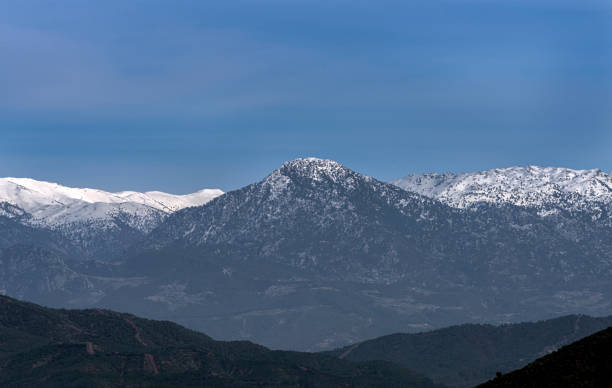 istock Snowy peak of mountains and blue sky 1375236461