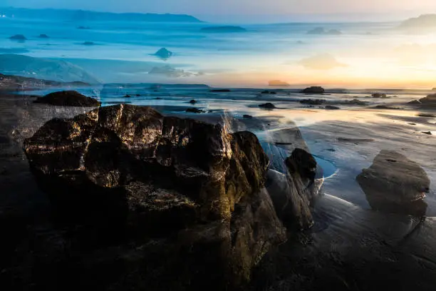 A double exposure-like image along the coastline in Cayucos, California.