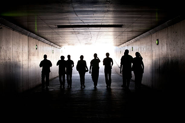 istock People walking out of the tunnel 137524127