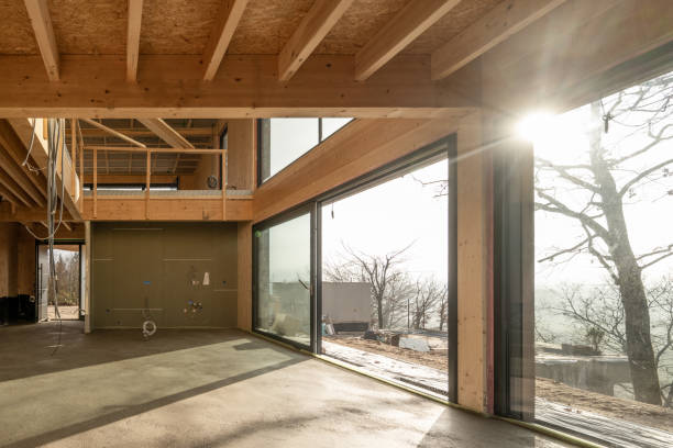 istock Wooden building interior, sun shinning through big windows 1375256445