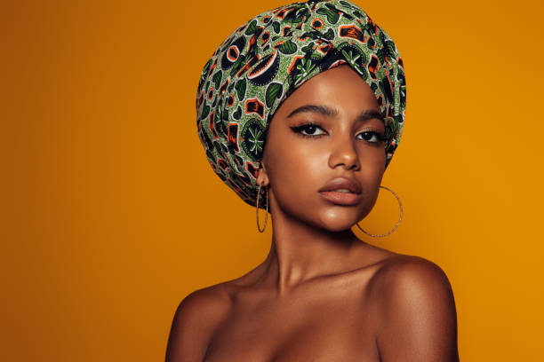 istock African woman with a colorful shawl on her head 1375256468