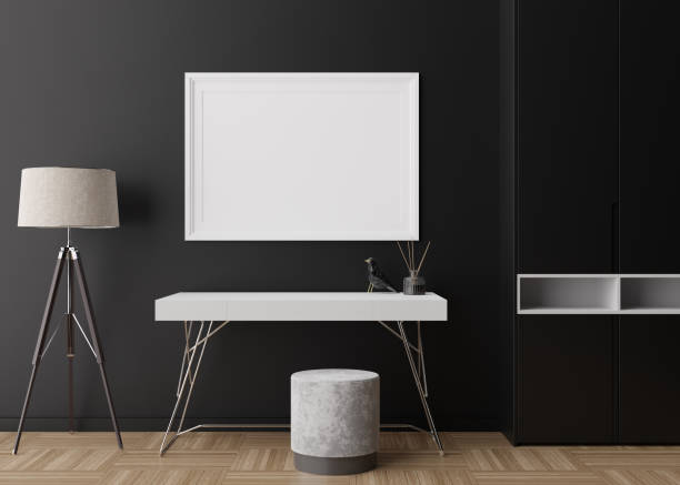 istock Empty picture frame on black wall in modern room. Mock up interior in contemporary style. Free space, copy space for your picture, poster. Table, lamp, parquet floor. 3D rendering. 1375260255