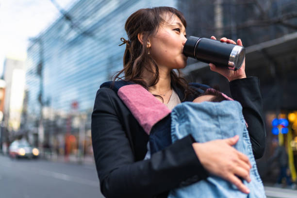 istock Working mother commuting with her small baby in the city 1375264542