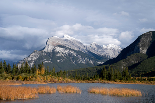 Rundle1 mountain and Vermillion Lake compete with dramatic, Banff skies for attention.