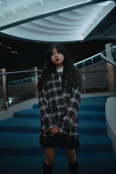 istock Asian young women on the bridge at night 1375343457