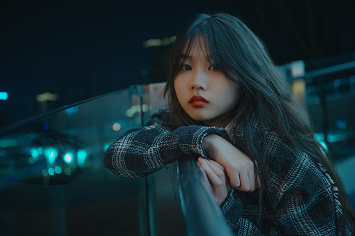 Asian young women on the bridge at night