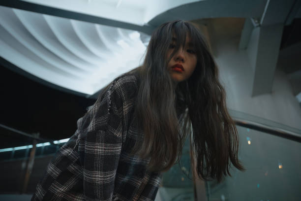 istock Asian young women on the bridge at night 1375343985