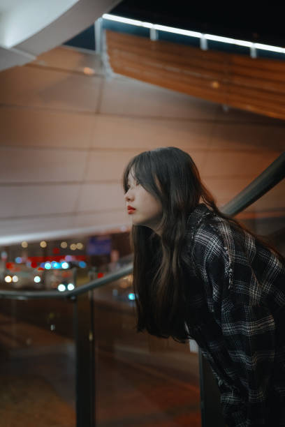 istock Asian young women on the bridge at night 1375346134