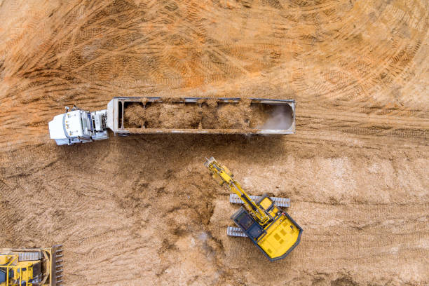 istock Aerial view at a crawler excavator digging soil excavating moving earth 1375346683