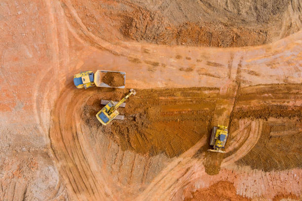 istock An excavator is loading something into a dump truck at the construction site 1375346685