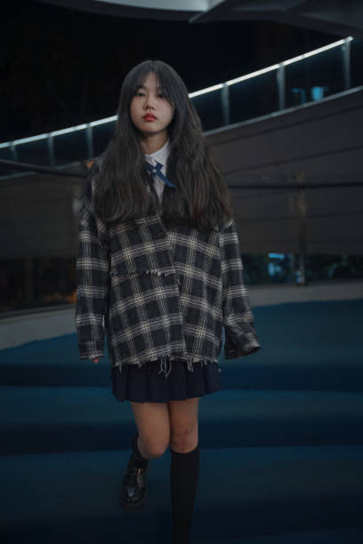 istock Asian young women on the bridge at night 1375349907