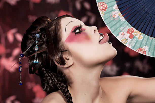 portrait of a beautiful white girl in geisha style stylized picture of a Japanese geisha, make-up done by professional Polish artist modern geisha stock pictures, royalty-free photos & images