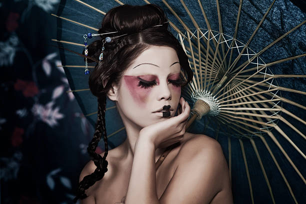 Fashion portrait of beautiful white girl in geisha attire stylized picture of a Japanese geisha, make-up done by professional Polish artist modern geisha stock pictures, royalty-free photos & images