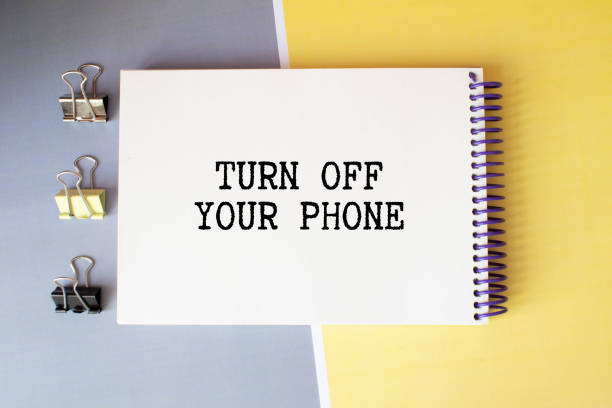 istock Business man pointing the text Turn Off Your Phone 1375367763