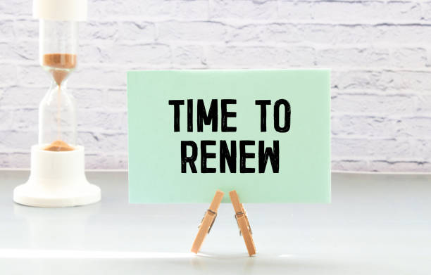 Time to Renew notepad writing on the white background with alarm clock. Time to Renew notepad writing on the white background with alarm clock new life stock pictures, royalty-free photos & images