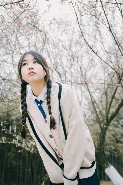 Beautiful asian girls under cherry trees