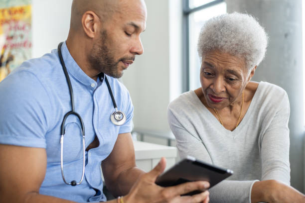 istock Reviewing Test Results at a Homecare Visit 1375404483