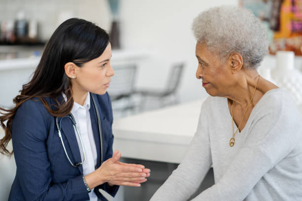 istock Reviewing Concerns at a Homecare Visit 1375404499