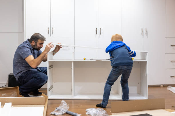 istock Father and Son Assembling New Furniture 1375425705