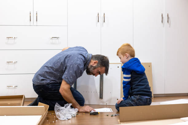 istock Father and Son Assembling New Furniture 1375425961