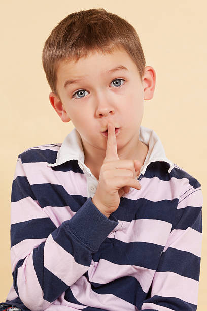 istock The secret. Finger over mouth. Psst. 137542611