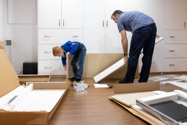istock Father and Son Assembling New Furniture 1375426525