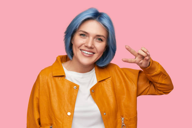istock Hipster woman showing peace sign 1375438809