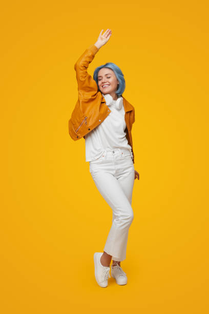 istock Delighted woman dancing in studio 1375439177