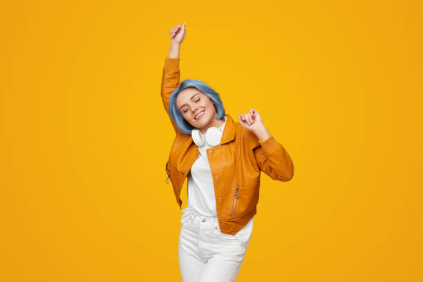 Stylish woman smiling and dancing