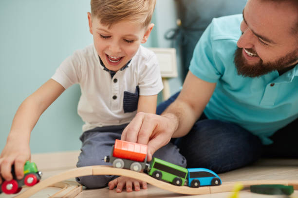 istock Father and son playing together 1375439383