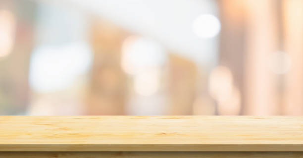 istock Empty wood table top with cafe restaurant interior blurred background 1375440544