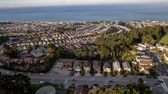 Aerial stock photo of a suburban neighborhood in Pacifica, California on the Coast.