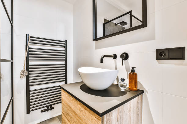 Modern bathroom interior with bathtub and cabinet double sinks