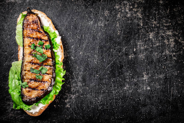 istock One sandwich with eggplant grilled on the table. 1375505101