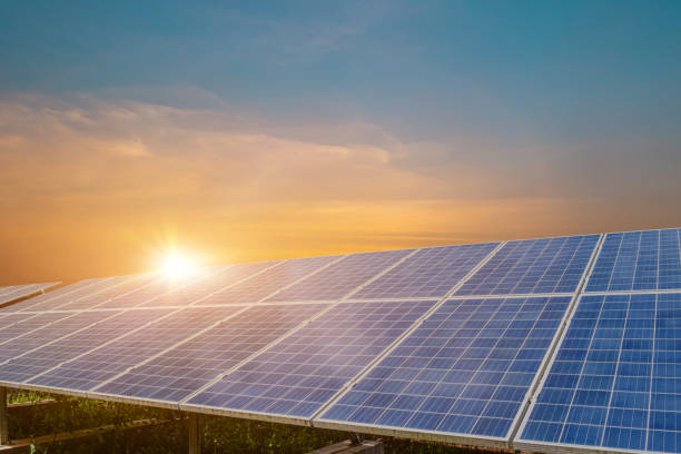 istock Solar panel at beautiful sunset sky background. Photovoltaic, alternative electricity source 1375506388
