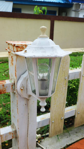 classic garden lamp on the side of the path stock photo