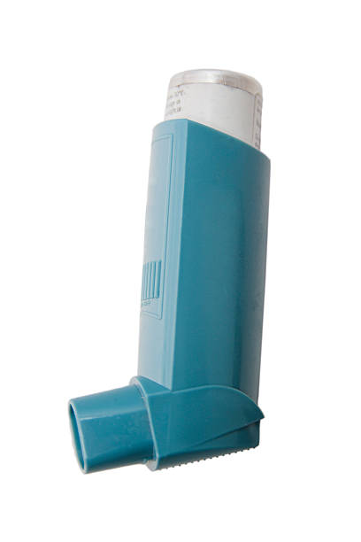 The classic blue asthma inhaler Asthma inhaler isolated on clean white background with no shadow. asthma inhaler stock pictures, royalty-free photos & images