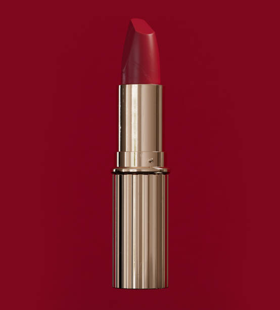 istock Single red lipstick on isolated red background 1375532626