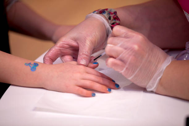 istock Kid getting nails done at teen spa. 1375562166