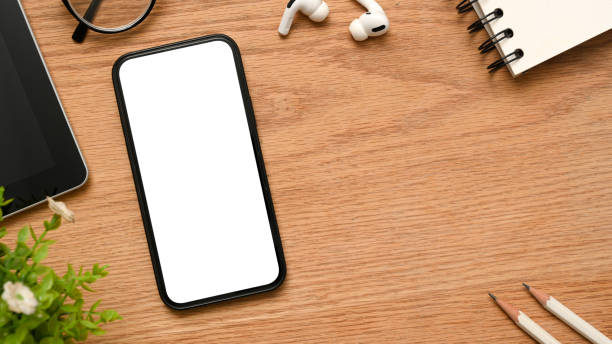 istock A telephone white empty screen mockup on minimal wooden desk 1375607898
