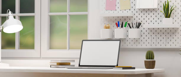 istock Minimal white office workspace with portable laptop 1375609436
