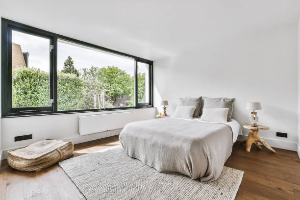 istock Stylish bedroom with a large window 1375656822